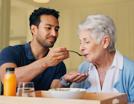 Man feeding grandma.